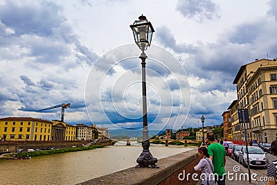 Arno river summer dramatic sky view Florence Italy Editorial Stock Photo