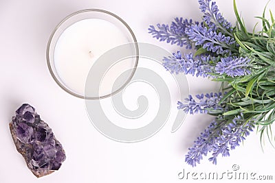 Aroma candle in glass with lavender flowers and amethyst Stock Photo