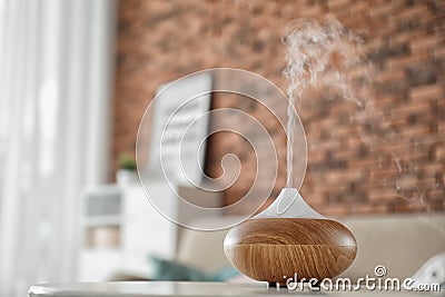 Aroma oil diffuser on table at home Stock Photo