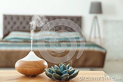 Aroma oil diffuser on table at home Stock Photo