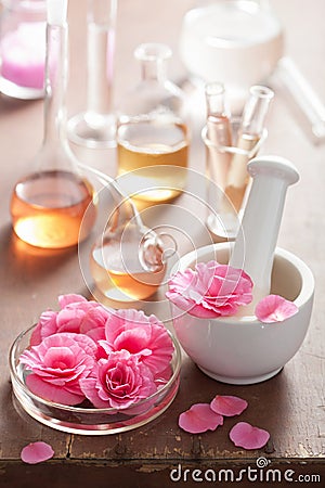 Aromatherapy and alchemy with pink flowers Stock Photo