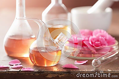 Aromatherapy and alchemy with pink flowers Stock Photo