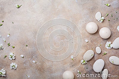 Aromatherapy, beauty and spa background with massage pebble and candles decorated with white flowers. Relaxation and zen like. Stock Photo