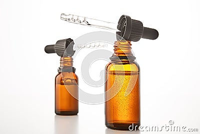 Aromatherapy brown open dropper bottles mockups. Stock Photo