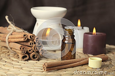 Aromatherapy - candles and cinnamon Stock Photo