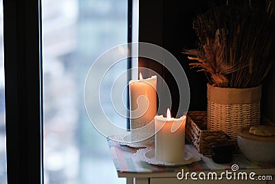 Aromatherapy votive candles burning with a soft glowing flame for a relaxation and pampering wellness treatment session Stock Photo