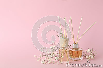 Aromatic concept with diffusers on pink background Stock Photo