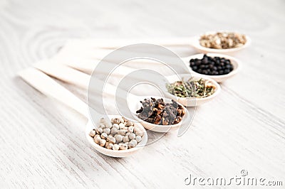 Aromatic food cooking ingredients. Black and white pepper, clove, savory, fennel seeds. Stock Photo