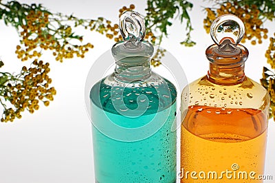 Aromatic oil and flowers Stock Photo