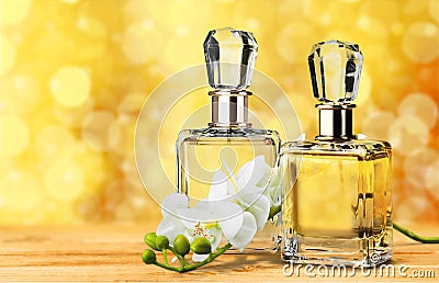 Aromatic Perfume bottles on golden background Stock Photo