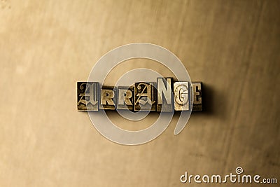 ARRANGE - close-up of grungy vintage typeset word on metal backdrop Stock Photo