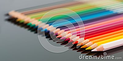 Arranged colored wood pencils lying Stock Photo