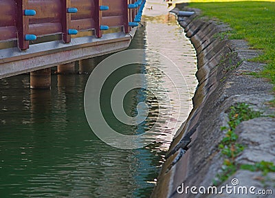 Arranged lake shore and wooden building on pillars, closeup Stock Photo