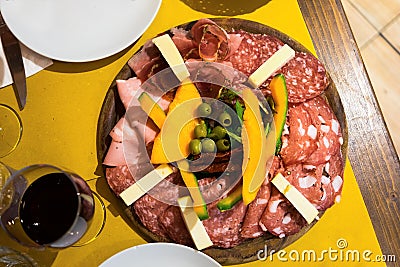 Arrangement of Delicatessen Cold Cuts with red wine and Smoked Ham finocchiona Stock Photo