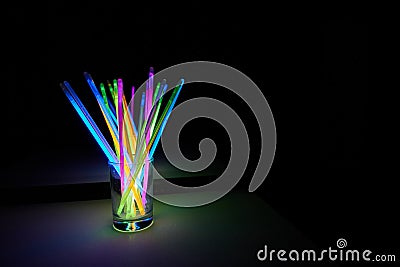 Arrangement of multi-colored glow sticks Stock Photo