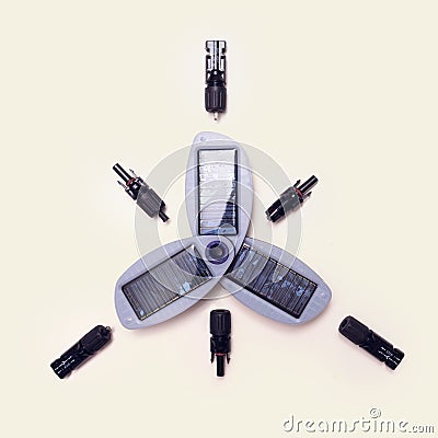 Arrangement of part for installation of adjustable solar panel mounting black female and male jack connectors on beige color Stock Photo