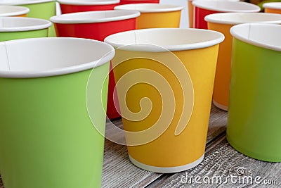 Arrangement of recycling disposable colorful paper cups, glass of red, yellow and green color Stock Photo