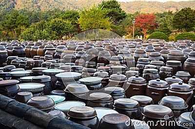 Arrangement of Traditional pottery earthern jar of fermentation korean souce Stock Photo
