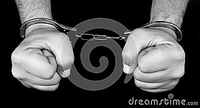 Arrest, hands with handcuffs. Stock Photo