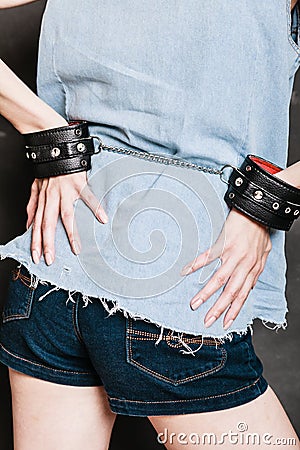 Arrest and jail. Closeup handcuffs on female hands Stock Photo