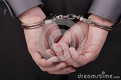 Arrested in handcuffs Stock Photo