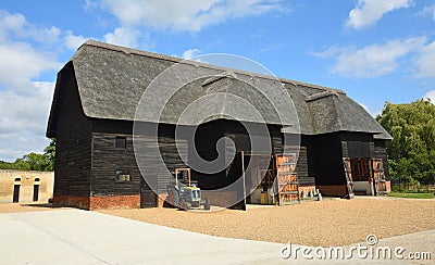 Beautiful Old Thatched Barn with doors open Editorial Stock Photo