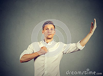 Arrogant bold self important stuck up man with napoleon complex Stock Photo