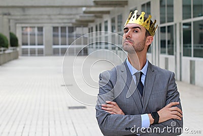 Arrogant businessman with a crown in office space Stock Photo