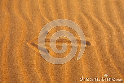 Arrow in the desert sand Stock Photo