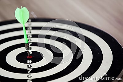 Arrow hitter on bull eye target Stock Photo