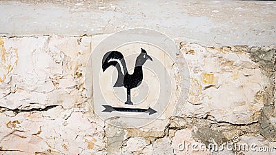 Arrow pointer with black cock on the way to Church of Saint Peter in Gallicantu, located on Mount Zion, Jerusalem Stock Photo