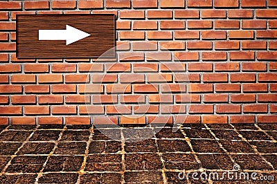 Arrow sign on brickwall pattern Stock Photo