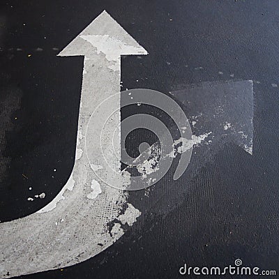 Arrow signage on an asphalt road indicating a detour Stock Photo