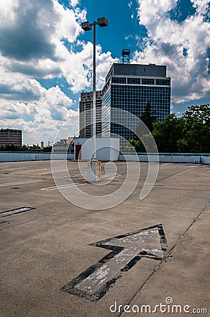 Arrow and view of highrises from a parking garage in Towson, MD Stock Photo