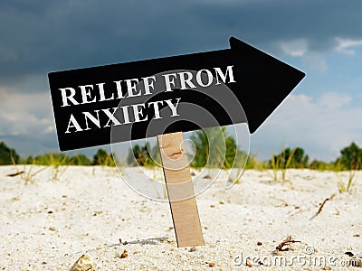 Arrow with words Relief from anxiety in a desert. Stock Photo