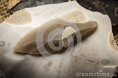 An arrowhead made from flintstone close up Stock Photo