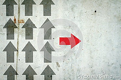 Arrows on a concrete wall. Red arrow, right direction. Leadership concept. Team. Business. Stock Photo