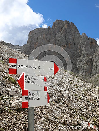 arrows of the paths with the Italian names of the mountain places in the Alps in North Italy Stock Photo