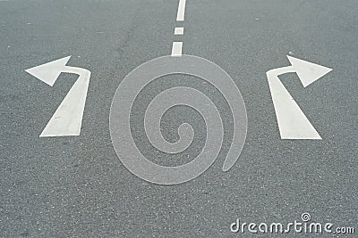 Arrows to the Right and Left on a Street - A Concept for Decisions Stock Photo