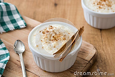 Arroz con leche. Rice pudding with cinnamon on wood Stock Photo