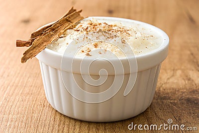 Arroz con leche. Rice pudding with cinnamon on wood Stock Photo