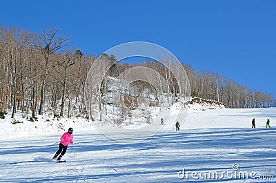 Arsenyev, Russia, January, 28, 2017. The man down the ski slope in the city of Arsenyev, Primorsky Krai Editorial Stock Photo