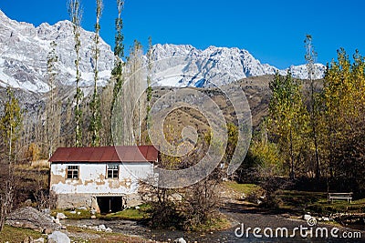 ARSLANBOB, KYRGYZSTAN: View of Arslanbob village in southern Kyrgyzstan, with mountains in the background during autumn. Stock Photo