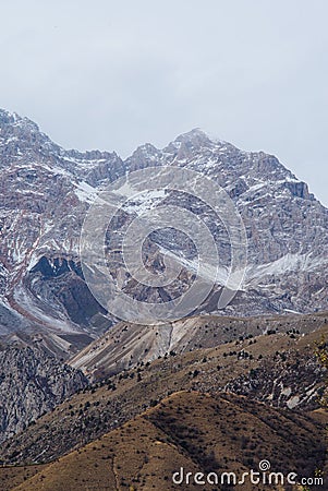 ARSLANBOB, KYRGYZSTAN: View of Arslanbob village in southern Kyrgyzstan, with mountains in the background during autumn. Stock Photo