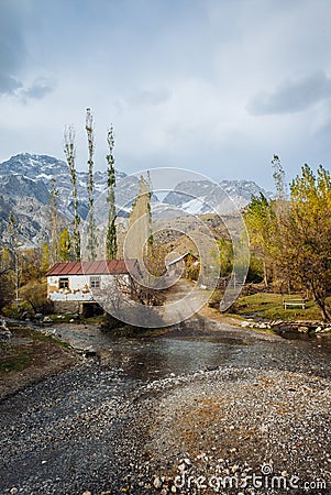 ARSLANBOB, KYRGYZSTAN: View of Arslanbob village in southern Kyrgyzstan, with mountains in the background during autumn. Stock Photo