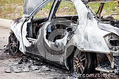 Arson fire burnt wheel car vehicle junk Stock Photo