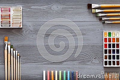 Art creative table background with supplies tools on grey wooden desk Stock Photo