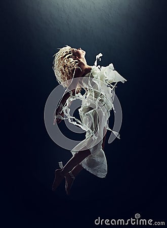 Art, dance and a ballet woman floating underwater for creative expression or theater performance. Freedom, energy and Stock Photo