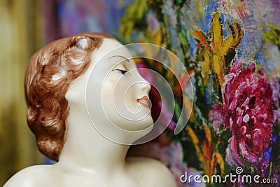 Art deco flapper girl antique statue with flowers Stock Photo