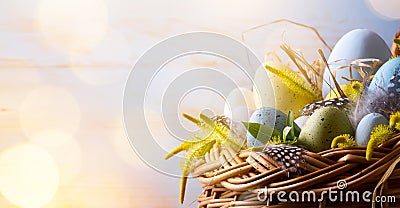 Art Easter background with Easter eggs in the basket Stock Photo